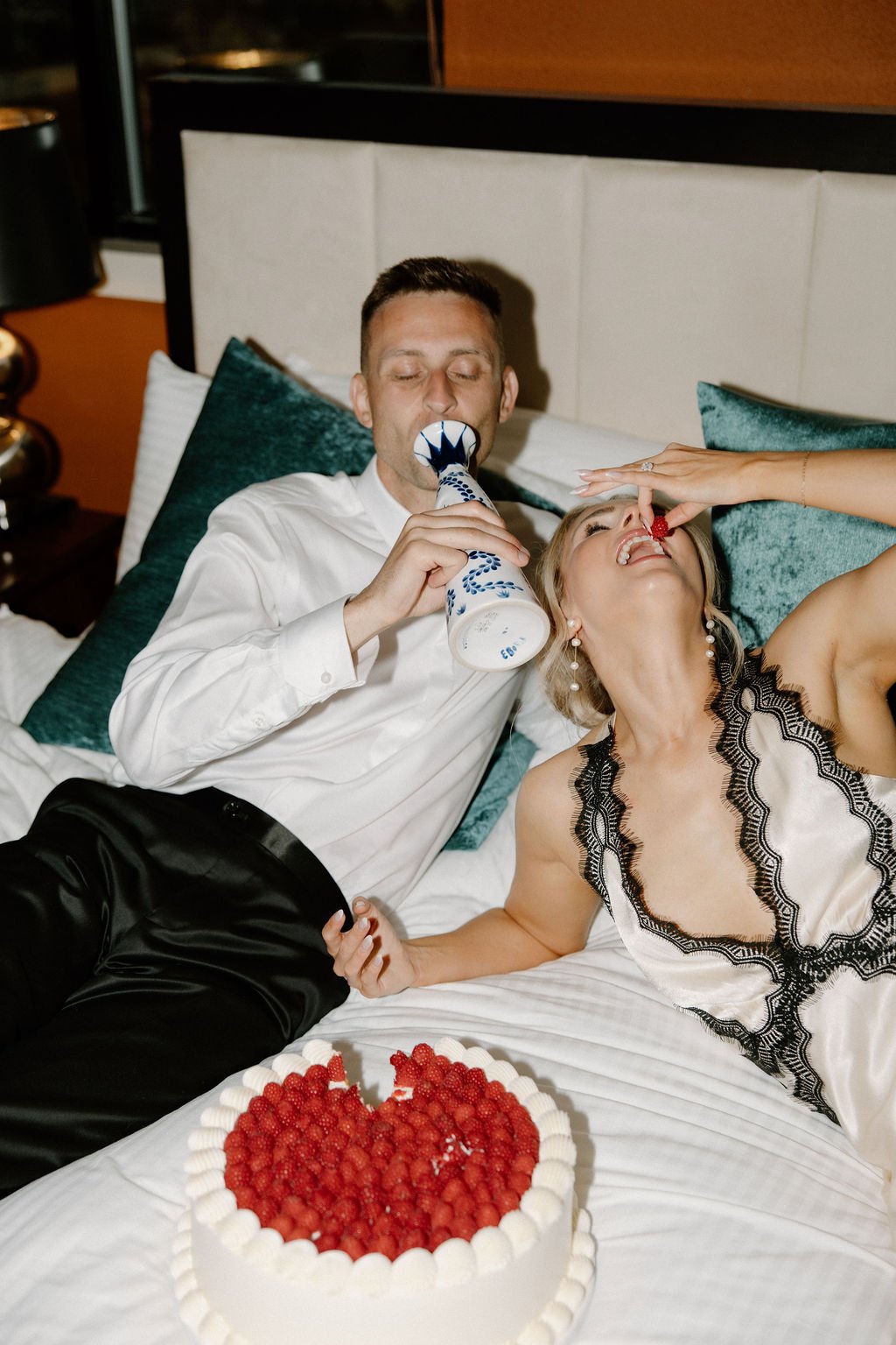 Bride and groom celebrating with cake and tequila at La Casa Lakeside Resort with Alyssa Beck Photography wedding rocky mountain bride, capturing candid and joyful moments.